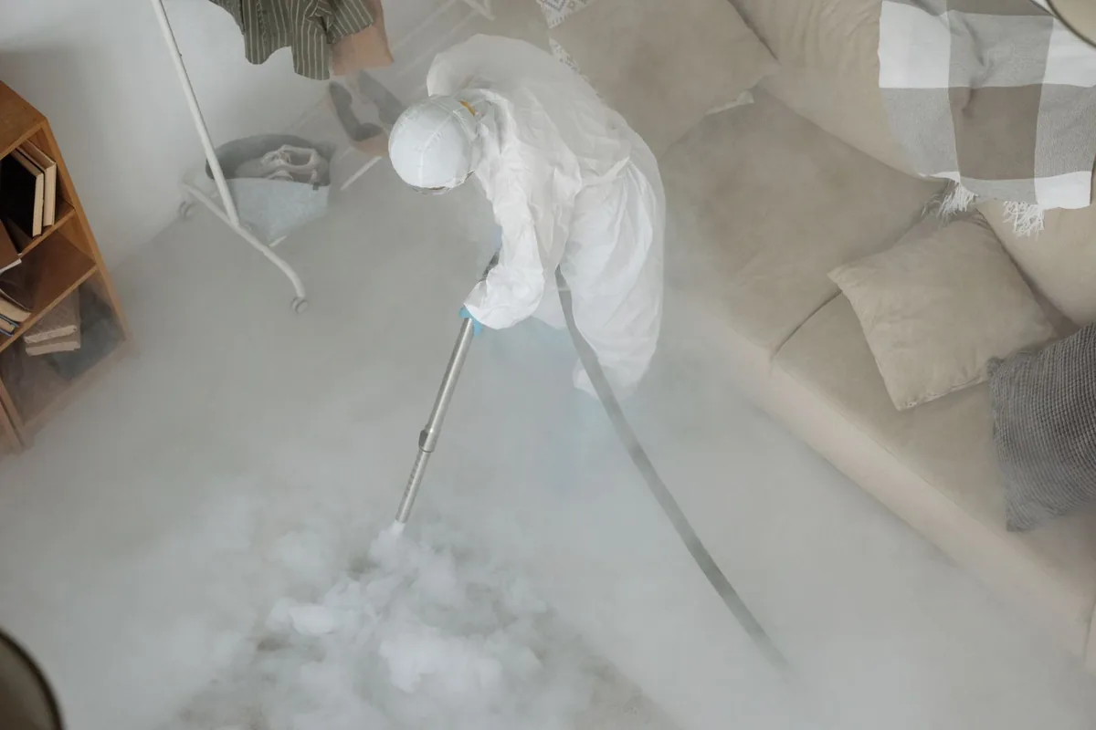Biohazard cleanup technician in protective equipment, Bar Harbor, ME